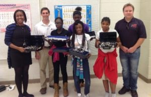 Price Band Director Tara Byrdsong, Big Note Music's Jim Schmeltzer,and The Gift of Music's Chris Monroe with the kids and their new instruments
